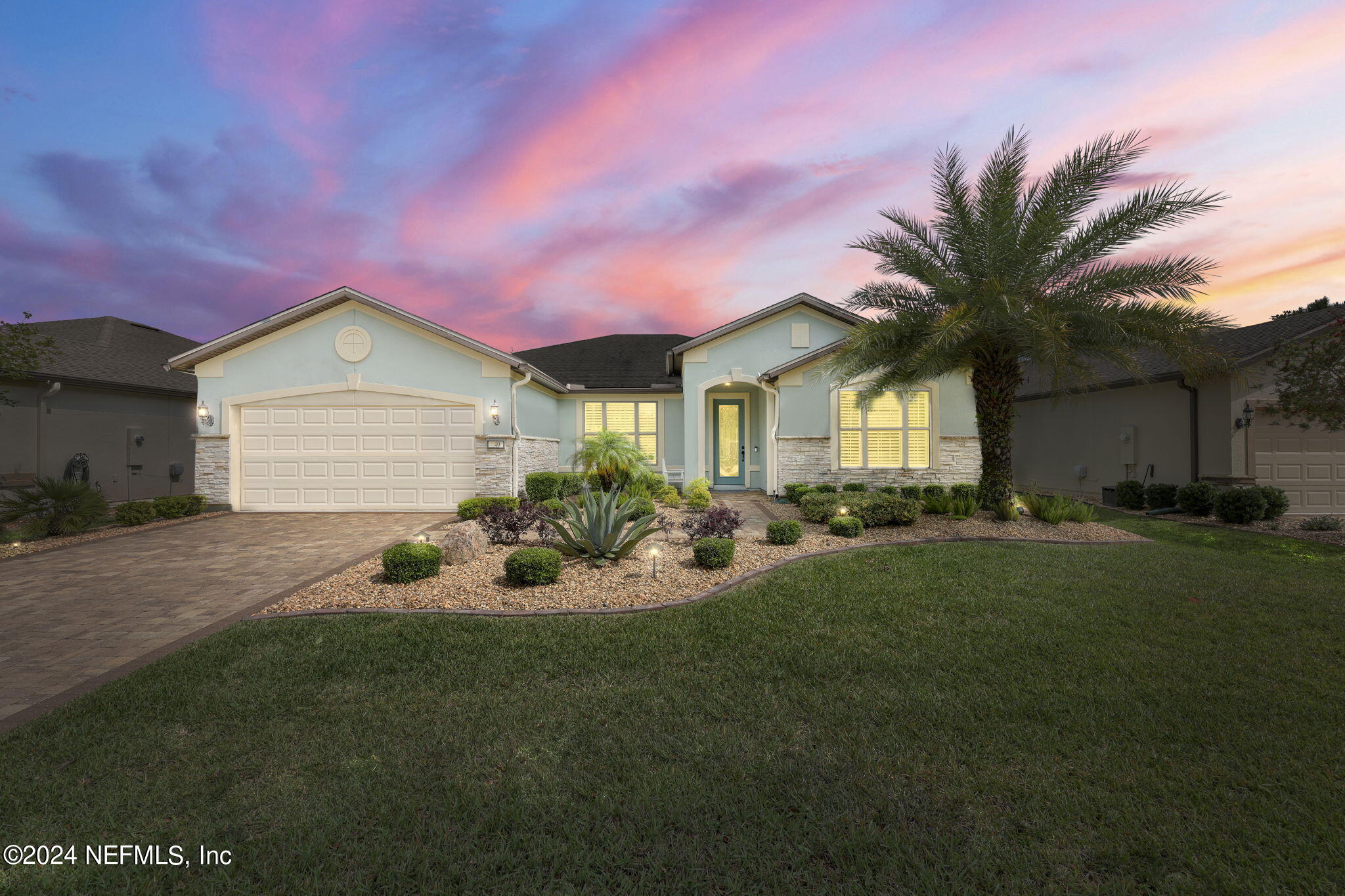 40 Tree Side Lane Ponte Vedra, FL 32081 - Photo 2 of 100 a front view of a house with a yard and garage