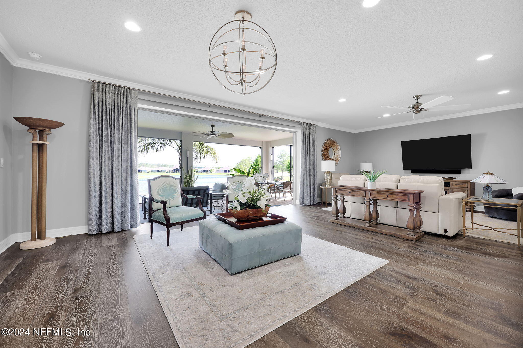 40 Tree Side Lane Ponte Vedra, FL 32081 - Photo 26 of 100 a living room with furniture a rug and a flat screen tv