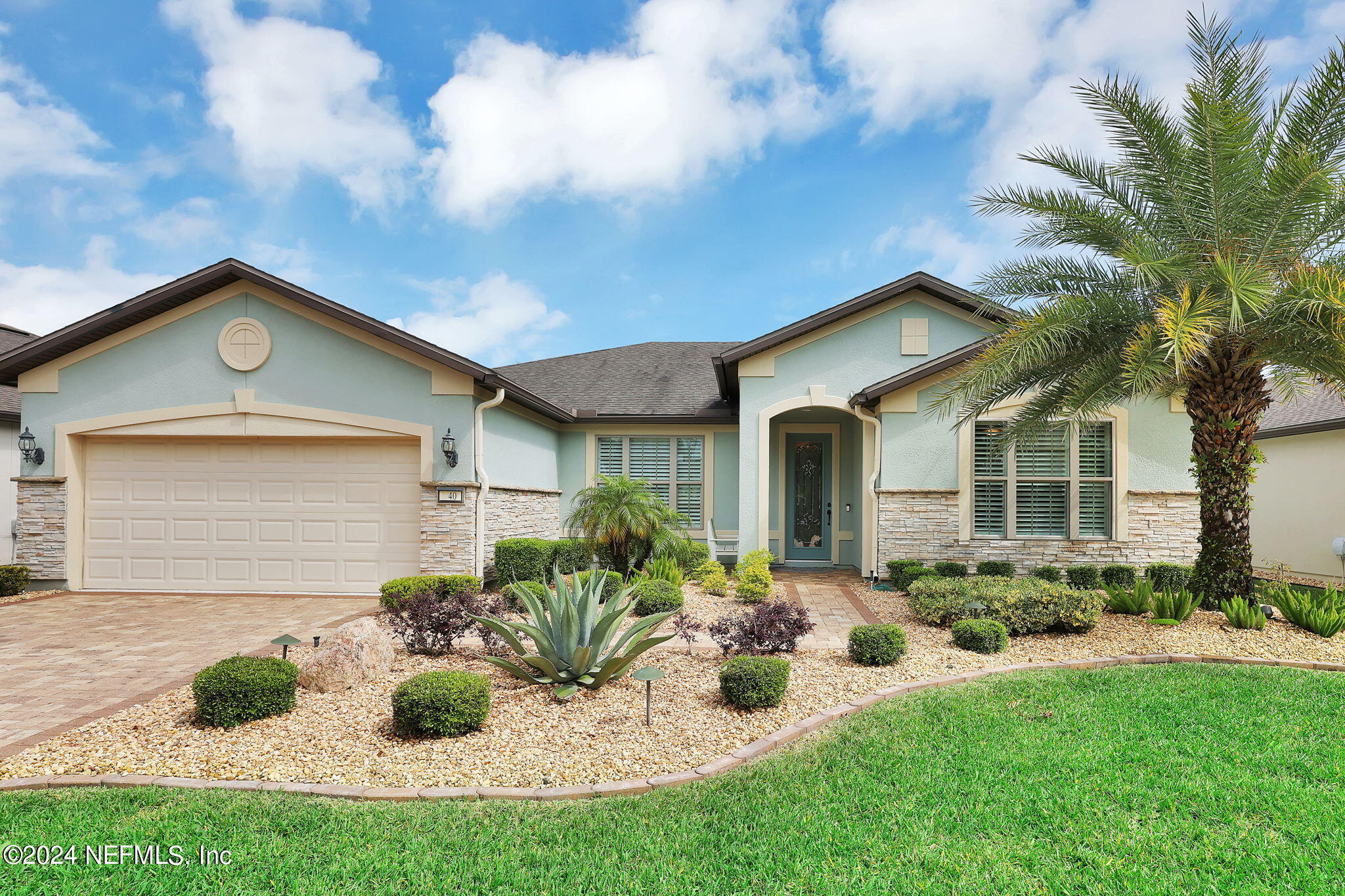 40 Tree Side Lane Ponte Vedra, FL 32081 - Photo 3 of 100 a front view of a house with yard and outdoor seating