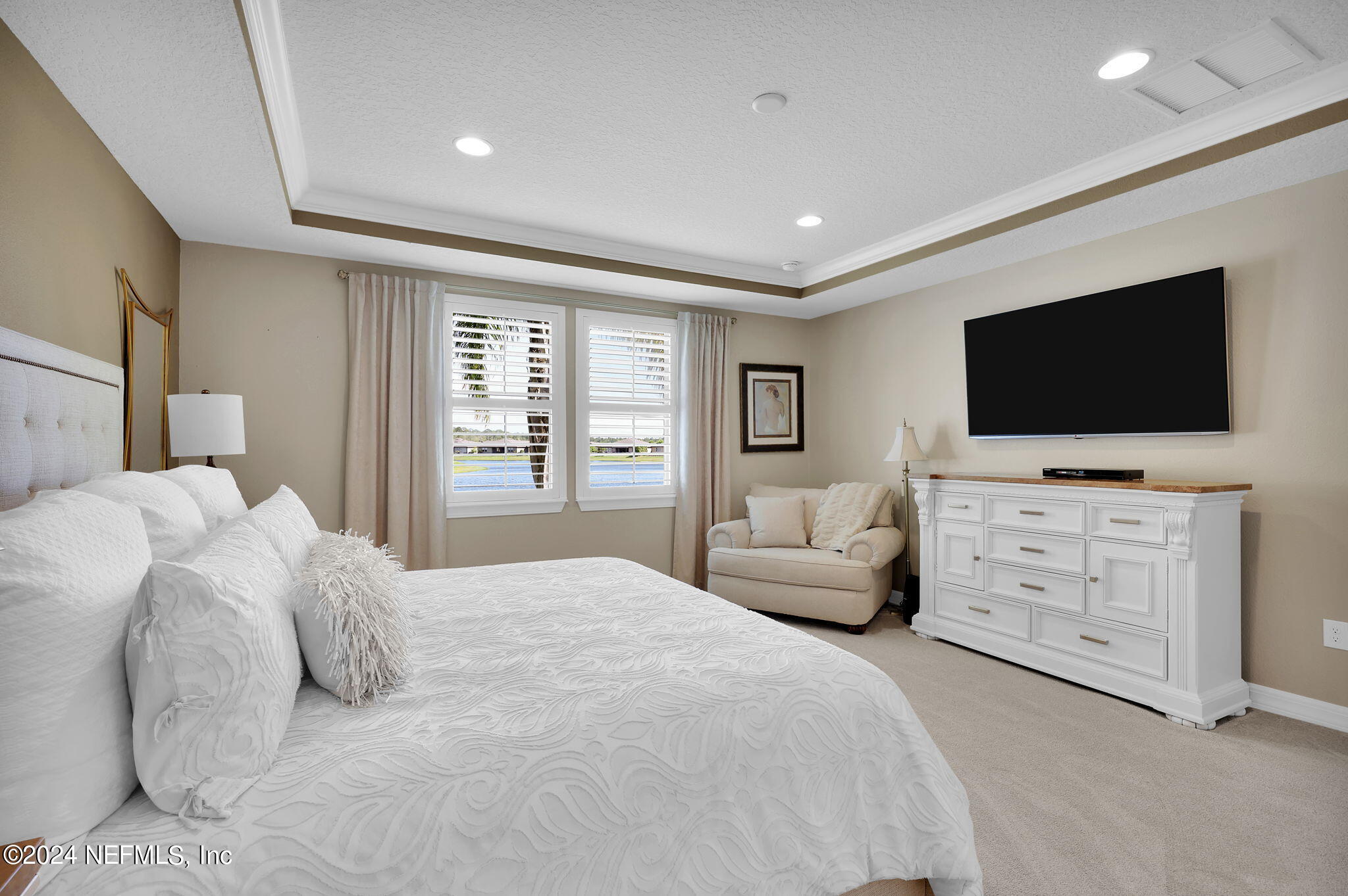 40 Tree Side Lane Ponte Vedra, FL 32081 - Photo 33 of 100 a bedroom with a bed and flat screen tv