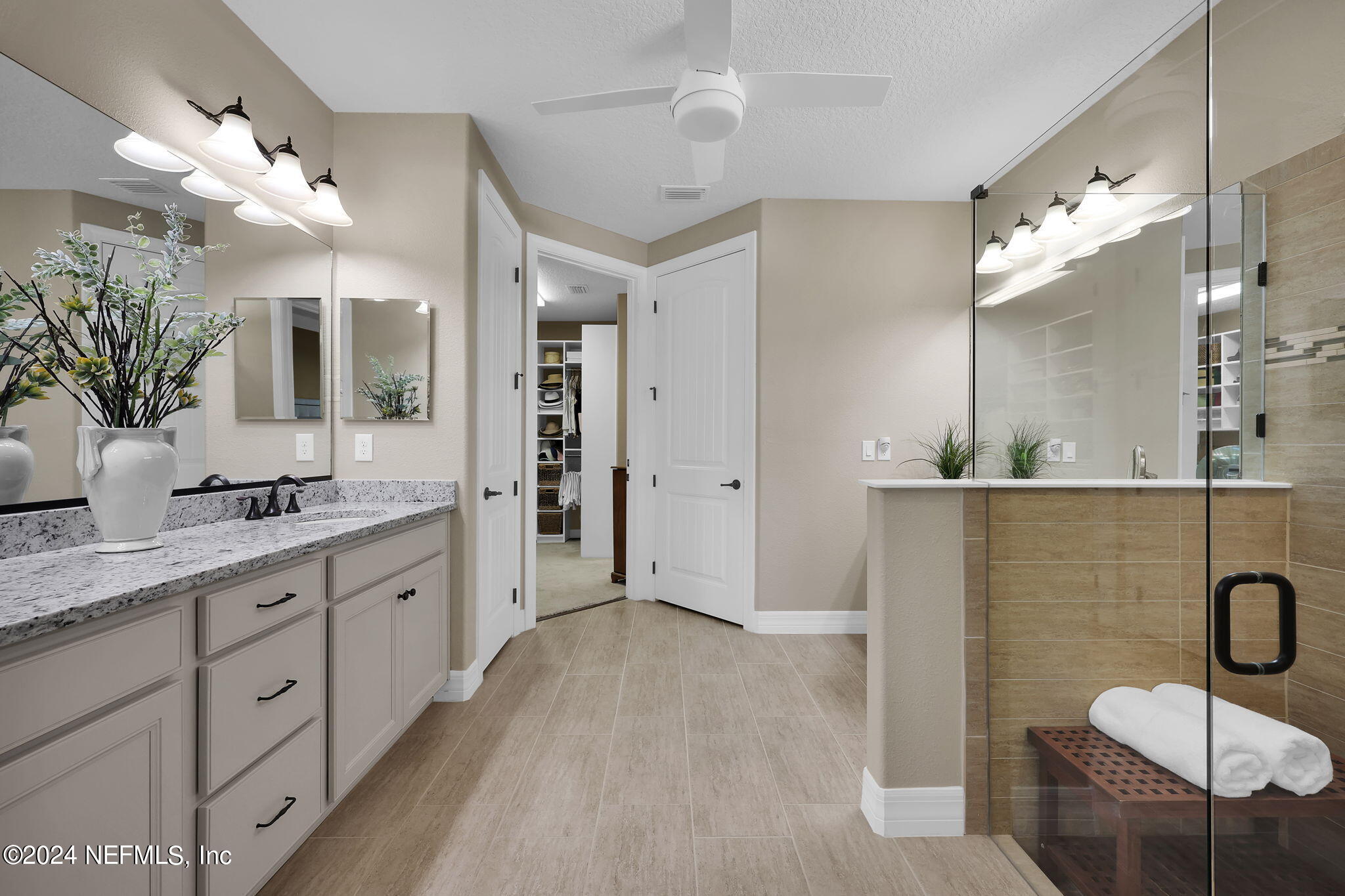 40 Tree Side Lane Ponte Vedra, FL 32081 - Photo 34 of 100 a spacious bathroom with a granite countertop sink a mirror and shower