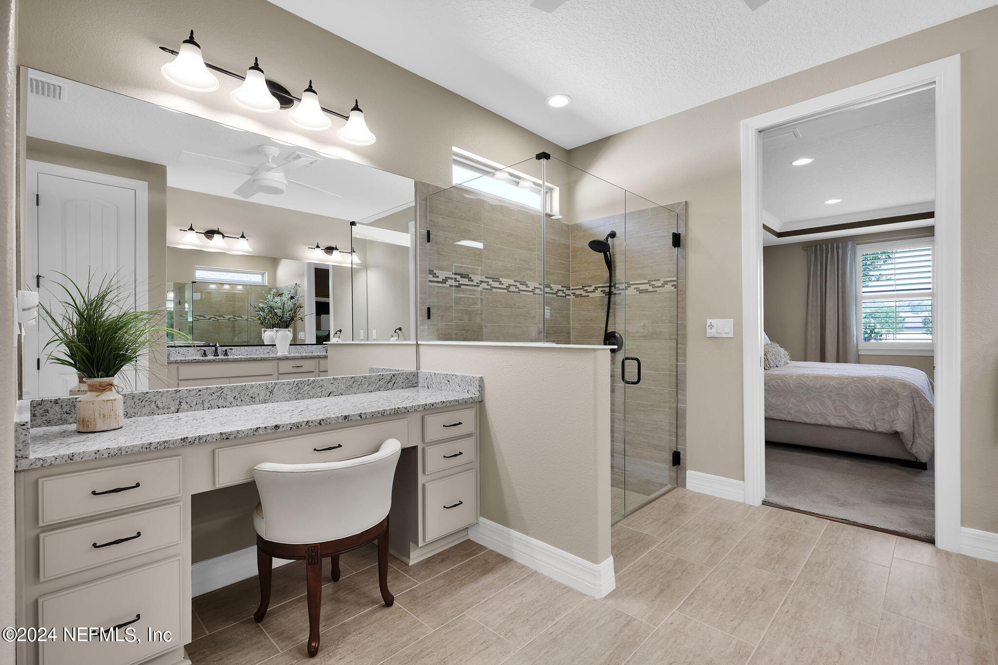 40 Tree Side Lane Ponte Vedra, FL 32081 - Photo 35 of 100 a spacious bathroom with a granite countertop sink and a mirror
