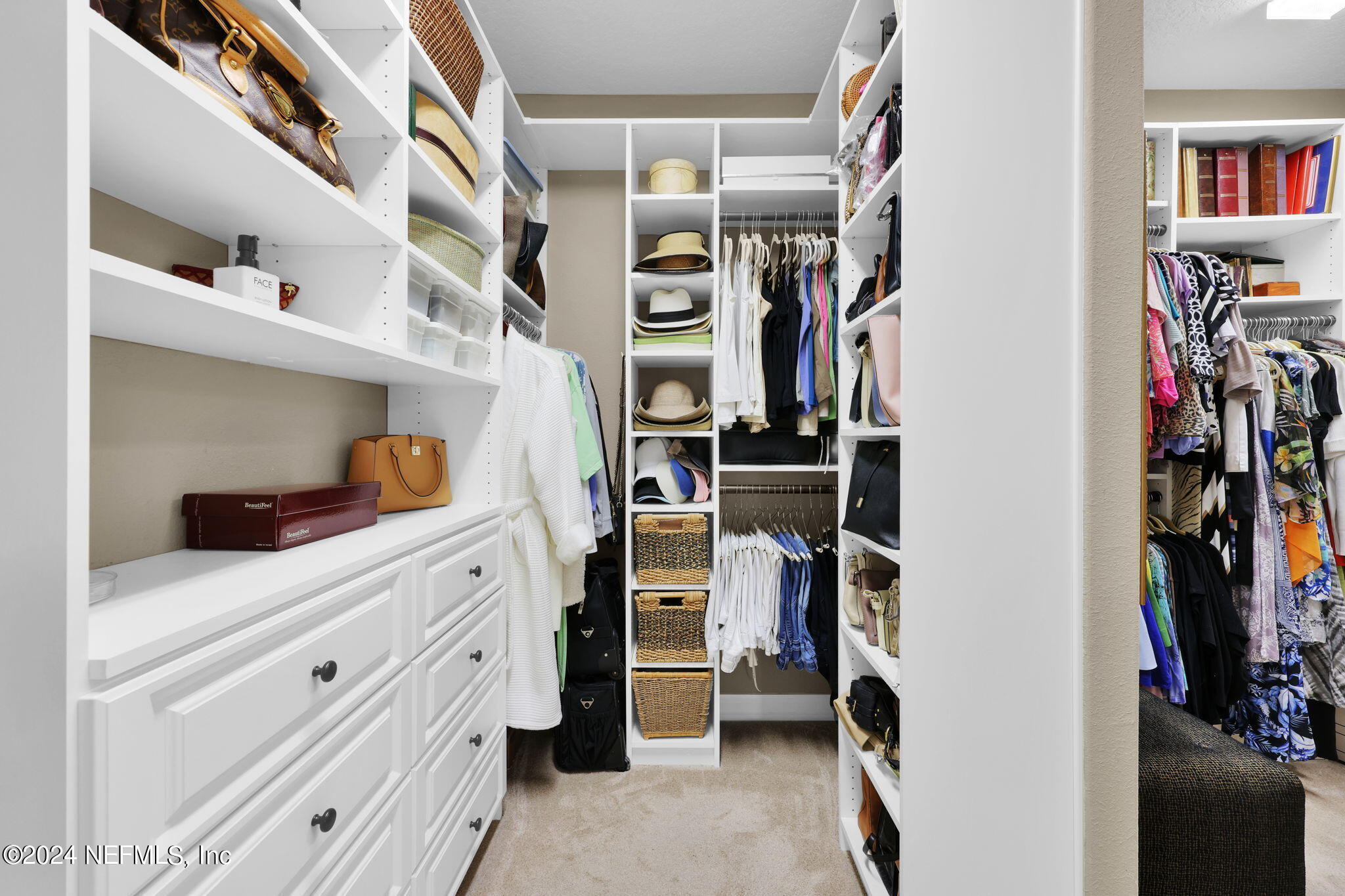 40 Tree Side Lane Ponte Vedra, FL 32081 - Photo 37 of 100 a view of walk in closet with clothes and shoes