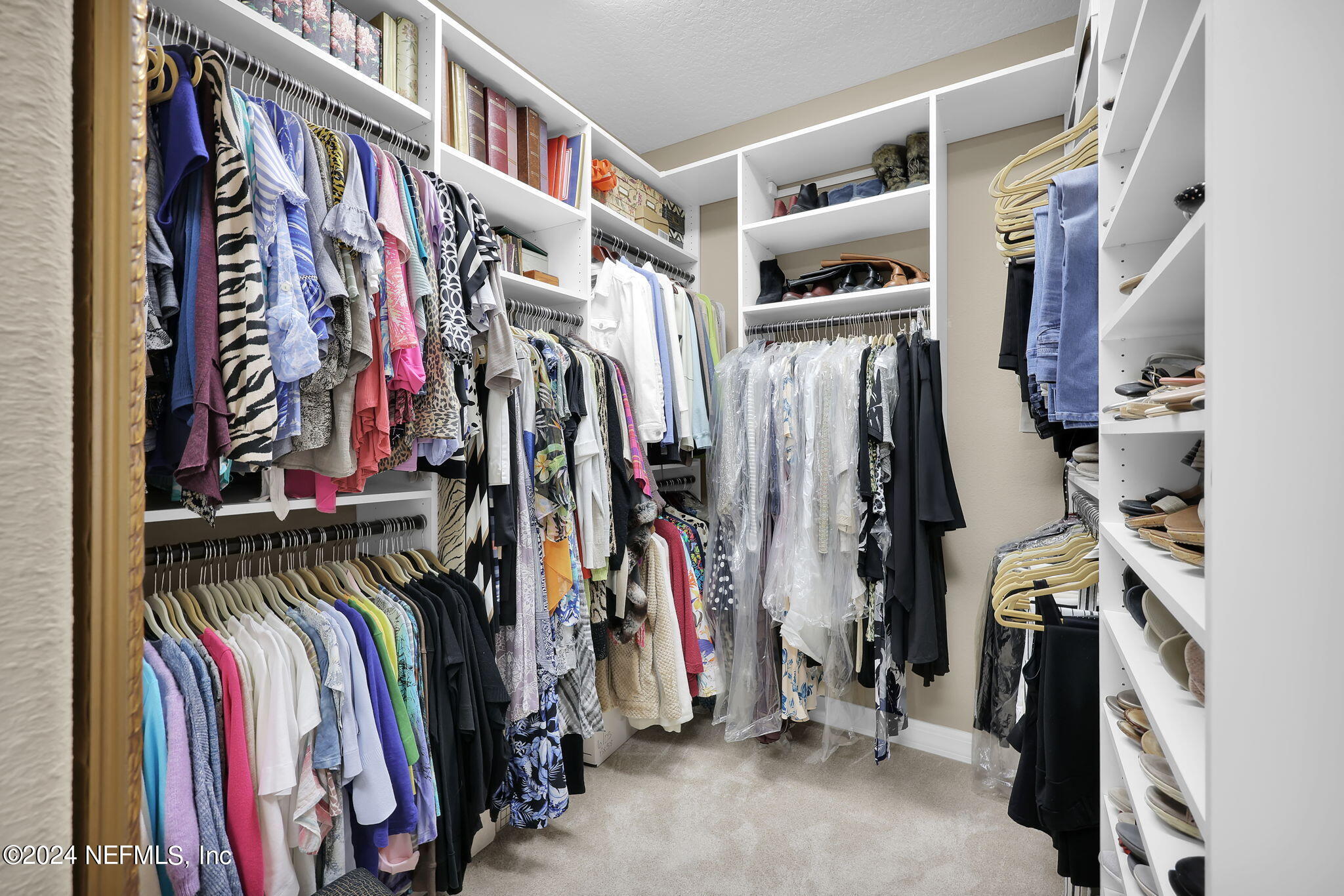 40 Tree Side Lane Ponte Vedra, FL 32081 - Photo 38 of 100 a view of walk in closet with clothes