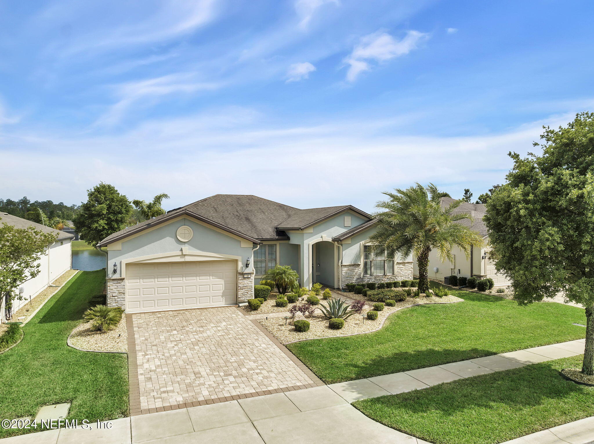 40 Tree Side Lane Ponte Vedra, FL 32081 - Photo 49 of 100 a front view of house with yard and green space