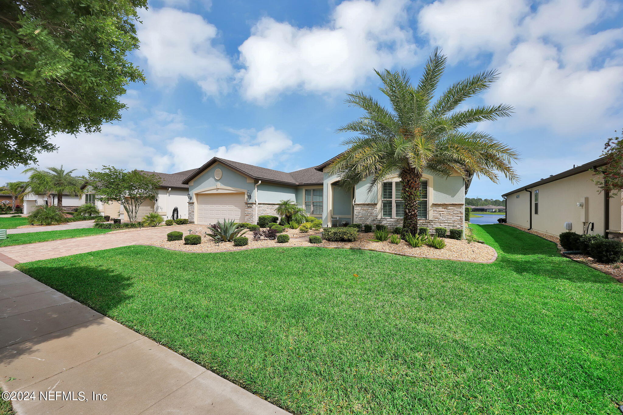 40 Tree Side Lane Ponte Vedra, FL 32081 - Photo 5 of 100 a front view of house with yard and green space
