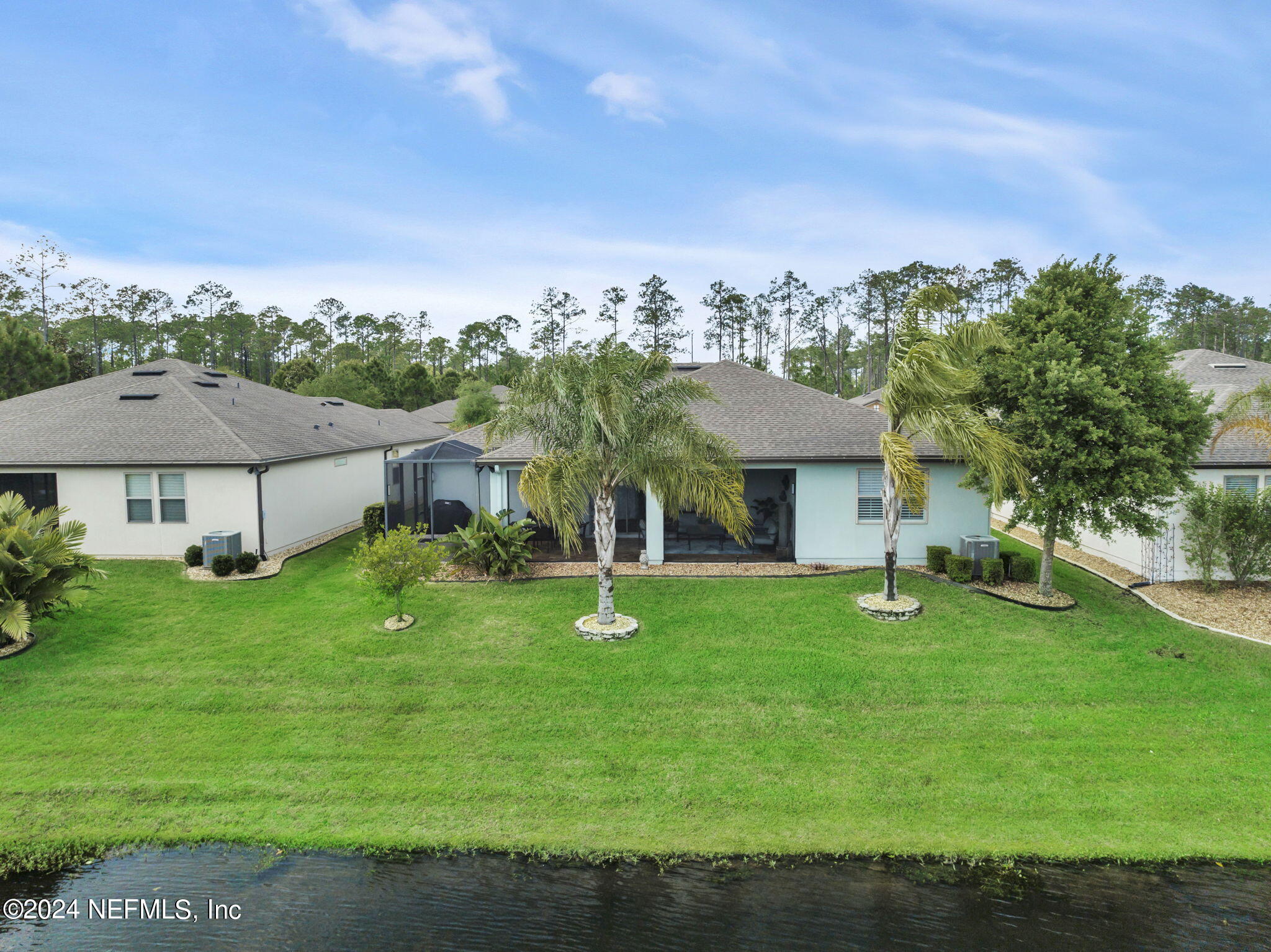 40 Tree Side Lane Ponte Vedra, FL 32081 - Photo 59 of 100 a front view of a house with garden
