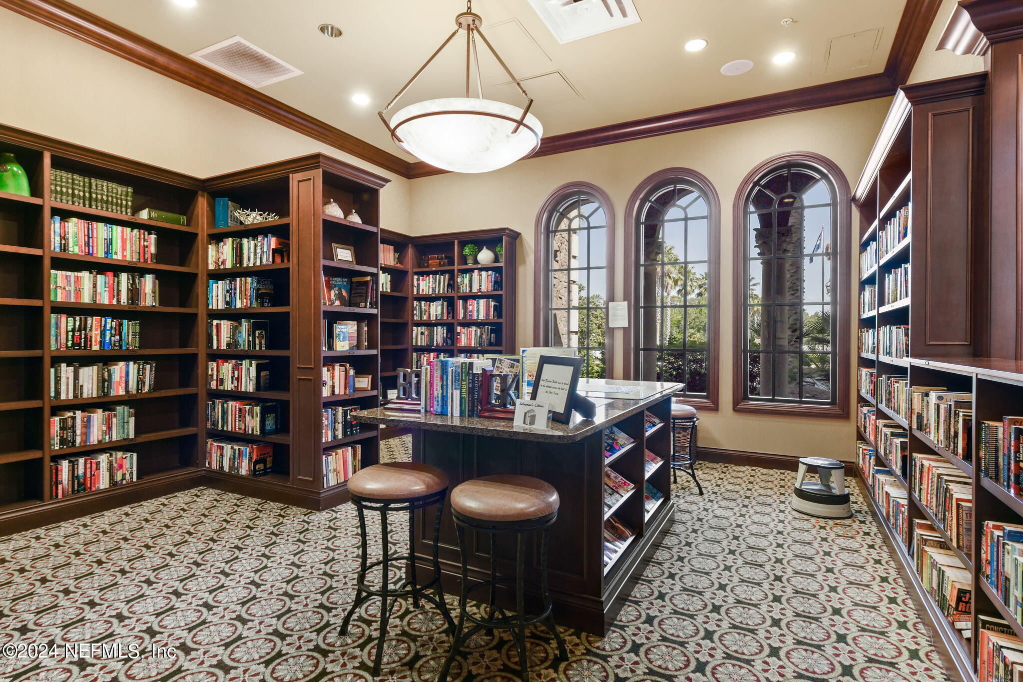 40 Tree Side Lane Ponte Vedra, FL 32081 - Photo 75 of 100 a living room with fireplace furniture and a book shelf