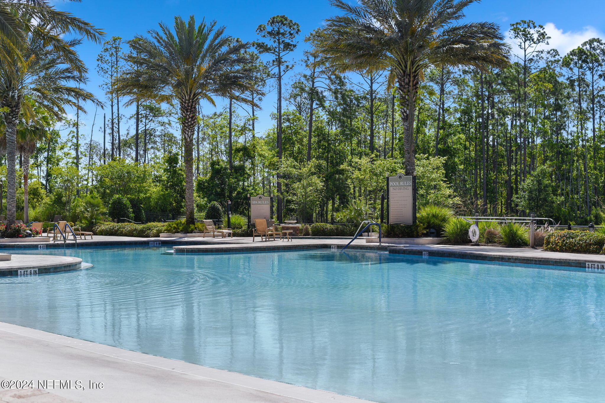 40 Tree Side Lane Ponte Vedra, FL 32081 - Photo 87 of 100 a view of a swimming pool with a table and chairs