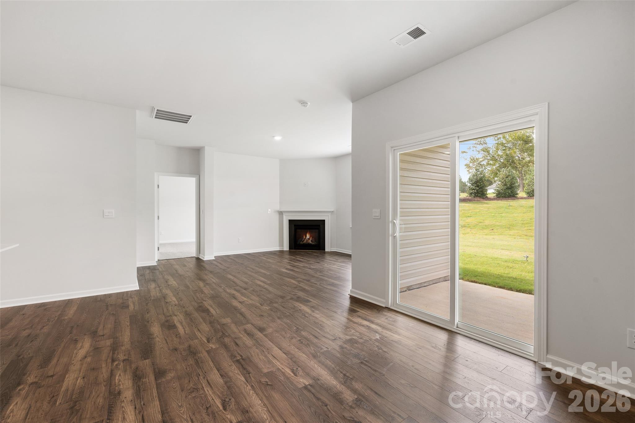 100 Piney Wds Road Fletcher, NC 28732 - Photo 16 of 33 a view of empty room with wooden floor and fan