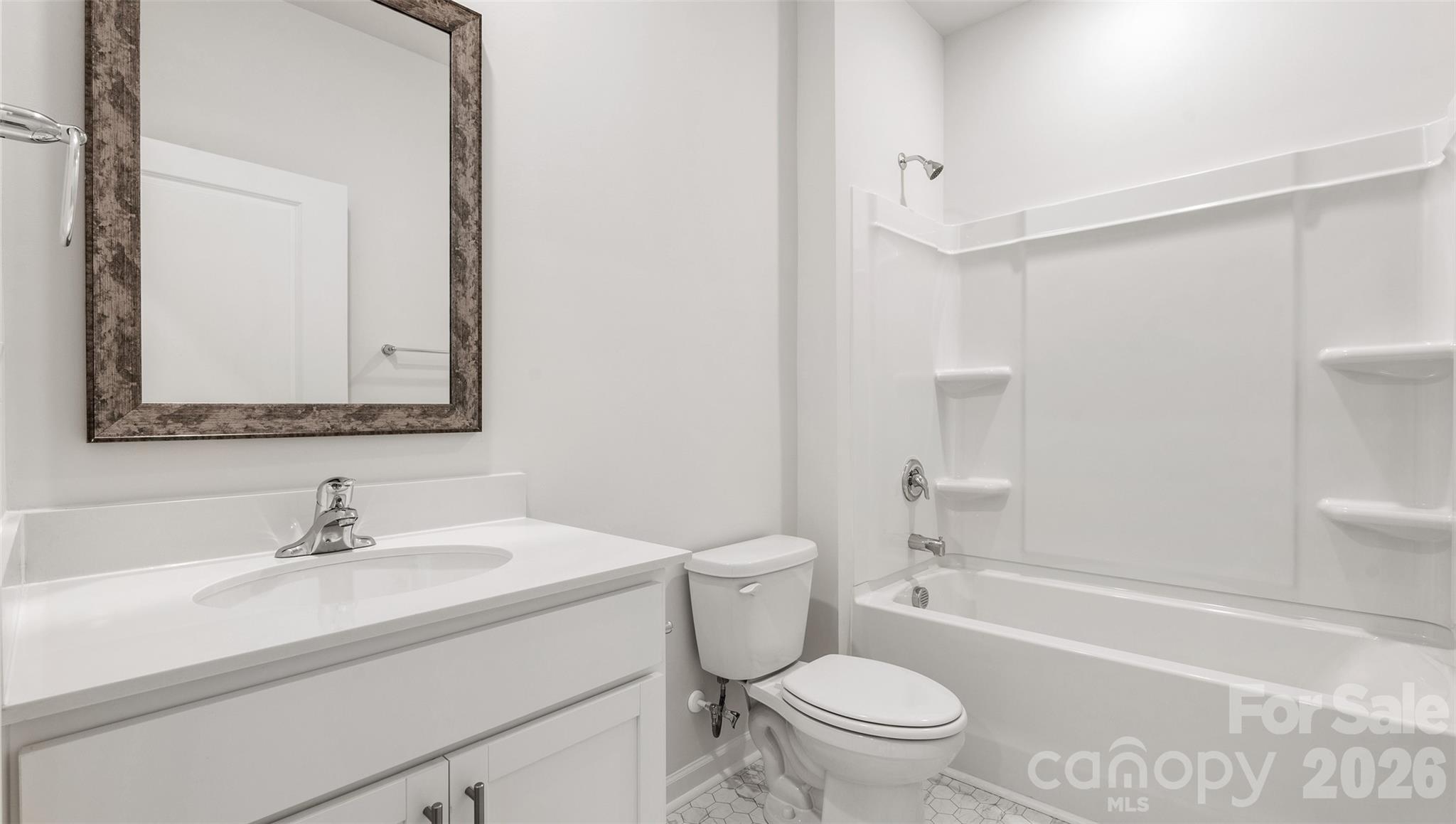 100 Piney Wds Road Fletcher, NC 28732 - Photo 19 of 33 a bathroom with a sink a toilet and a mirror