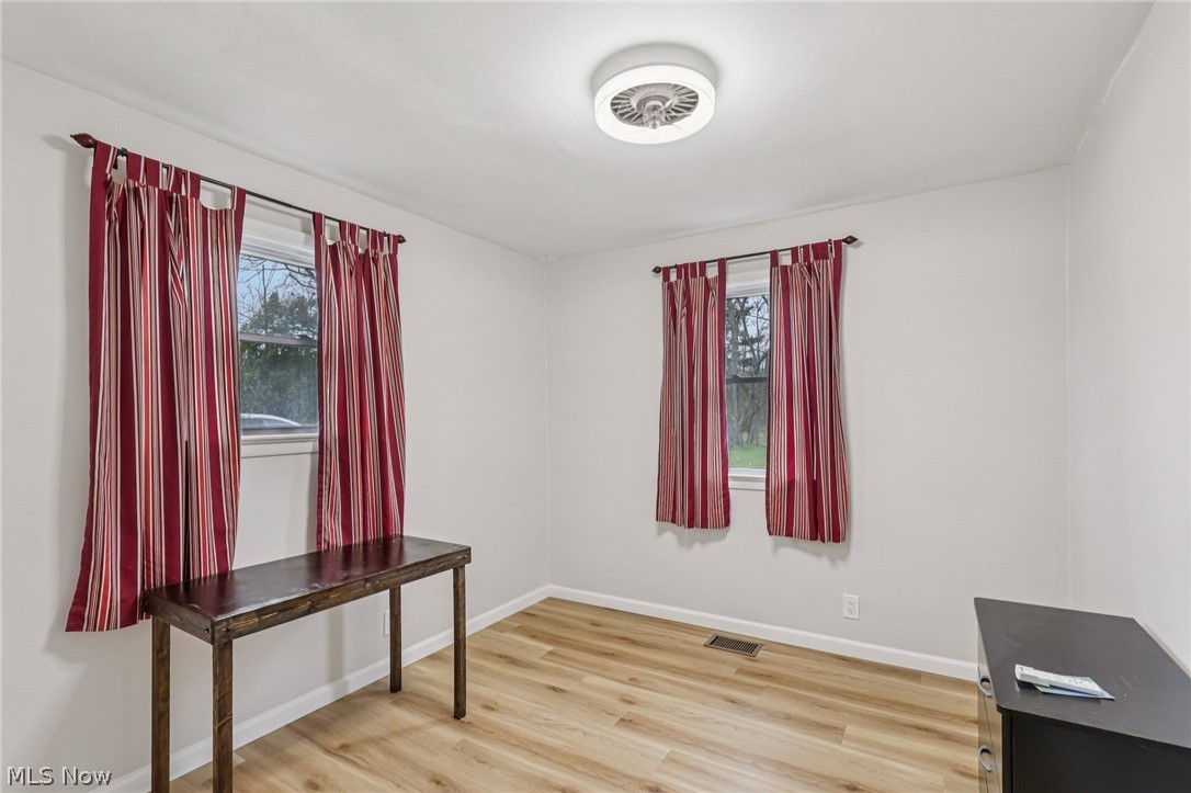 34825 Aurora Road Solon, OH 44139 - Photo 10 of 13 Empty room featuring light wood finished floors and baseboards
