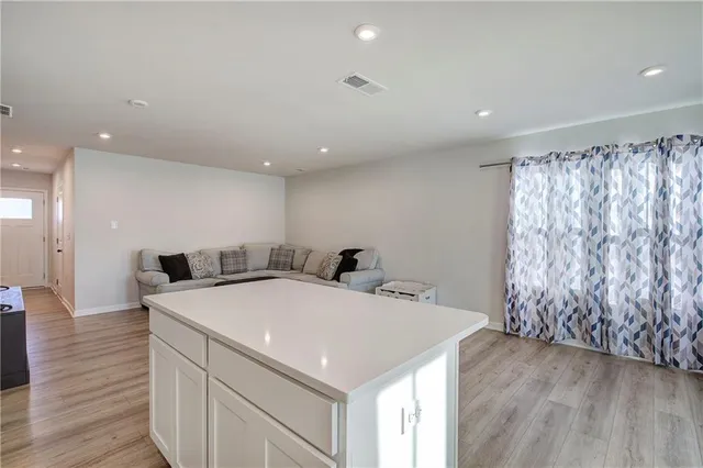 a kitchen with a sink and a stove top oven