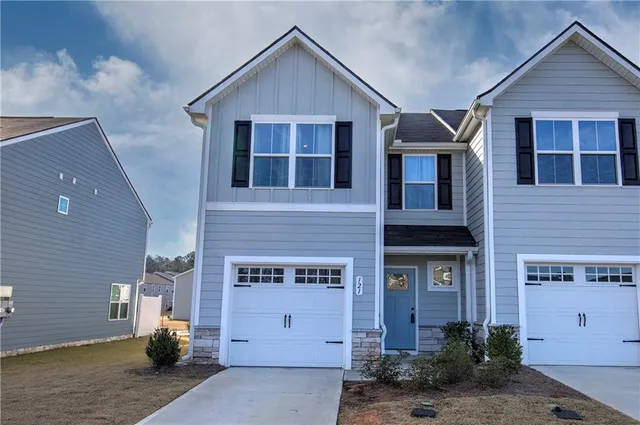 a front view of a house with a garage