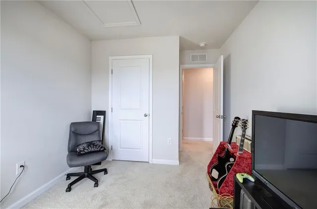 a bedroom with a workspace