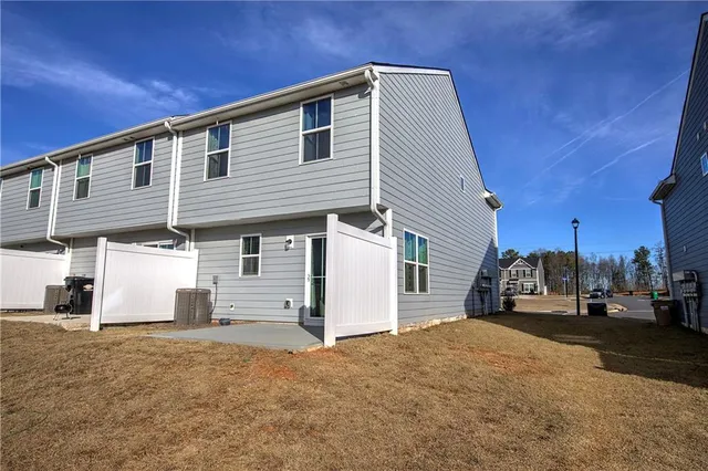 a view of a house with a street