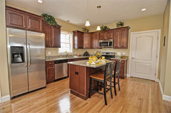 59 Partridge Hill Road Sutton, MA 01590 - Photo 3 of 16 a kitchen with kitchen island granite countertop a sink cabinets and stainless steel appliances
