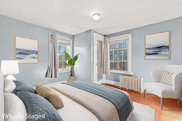 a bedroom with a bed and a couch