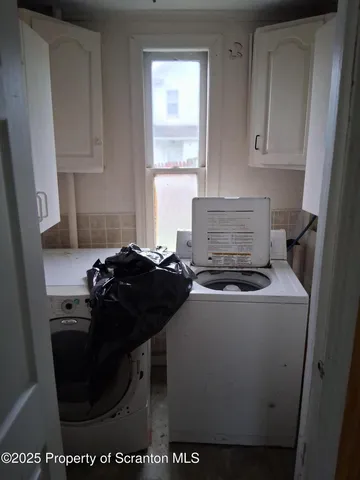 a kitchen with a stove and a window