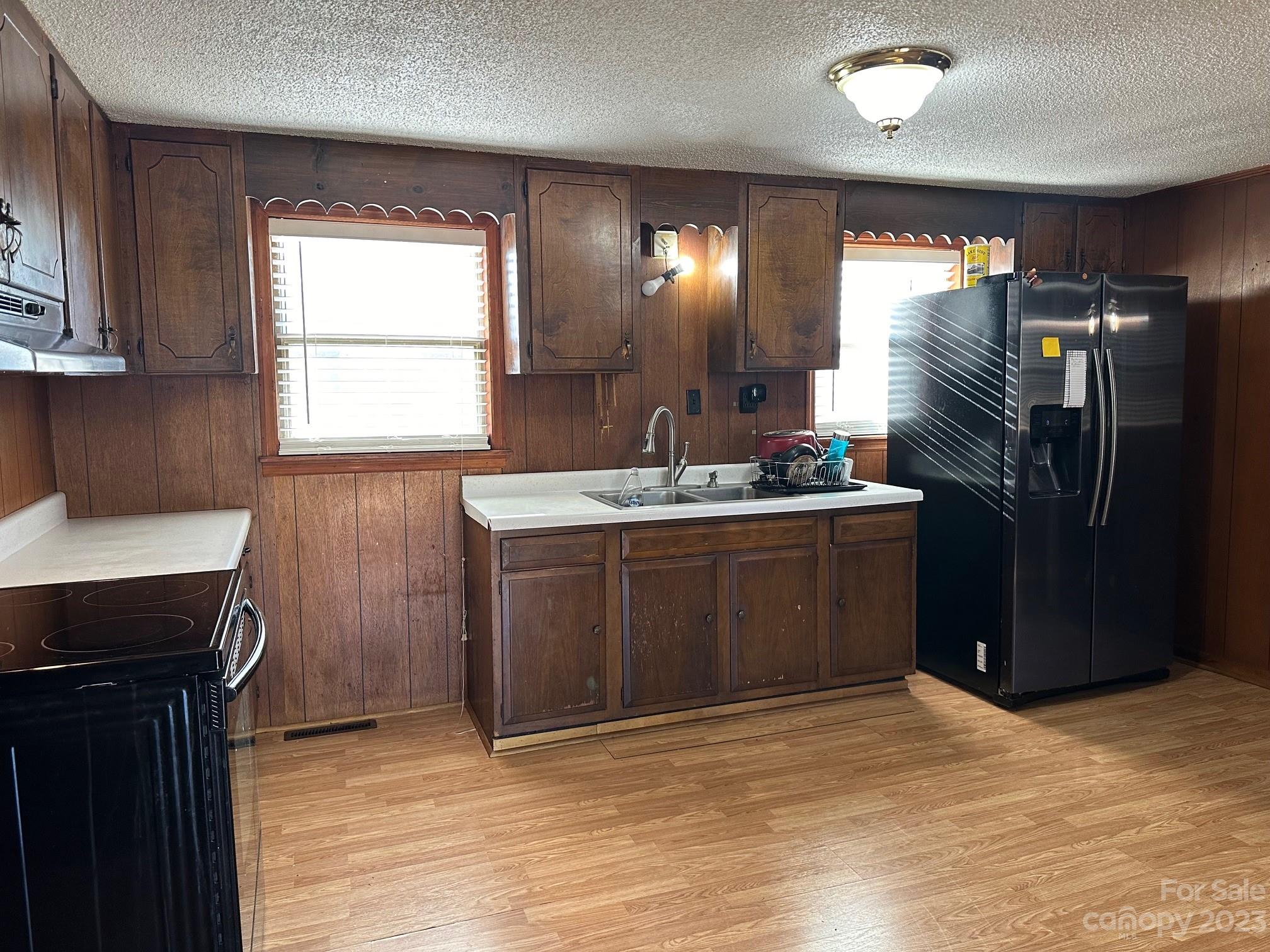 1133 State Rd S-28-547 Cassatt, SC 29032 - Photo 18 of 24 a kitchen with stainless steel appliances granite countertop a sink stove and refrigerator