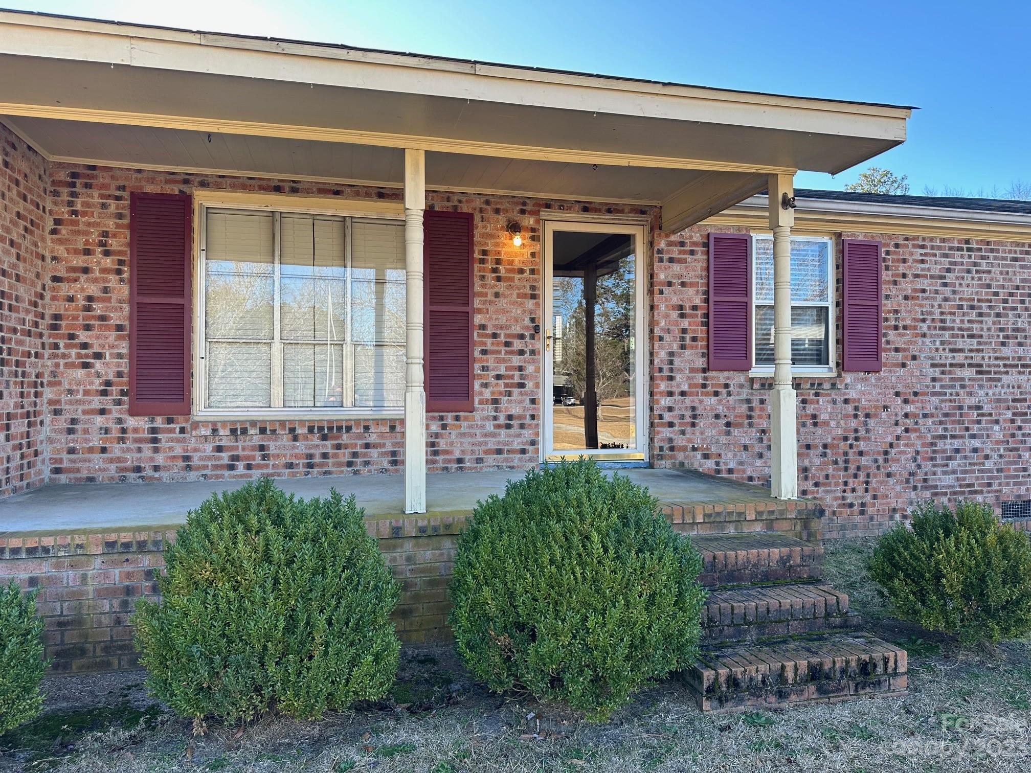 1133 State Rd S-28-547 Cassatt, SC 29032 - Photo 3 of 24 a front view of a house with a garden