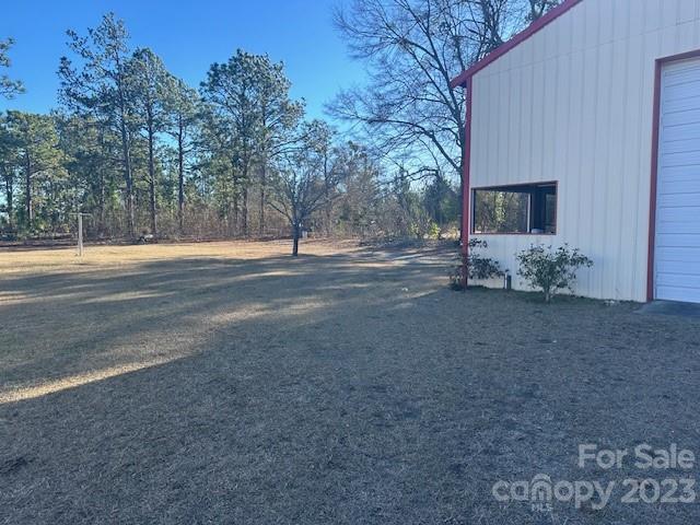 1133 State Rd S-28-547 Cassatt, SC 29032 - Photo 8 of 24 a view of a house with a yard