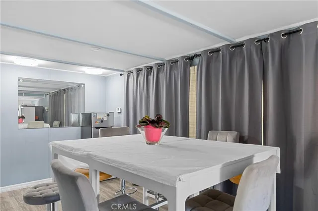 a very nice looking dining room with furniture