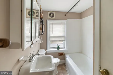 a view of a bathroom from a hallway