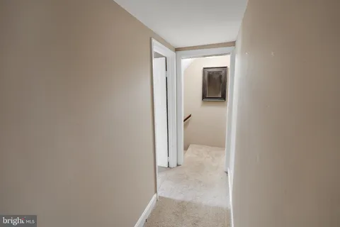 a view of hallway with closet