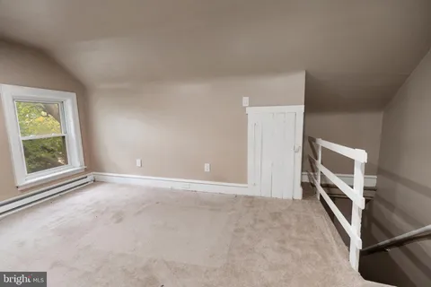 a view of storage and utility room with washer and dryer