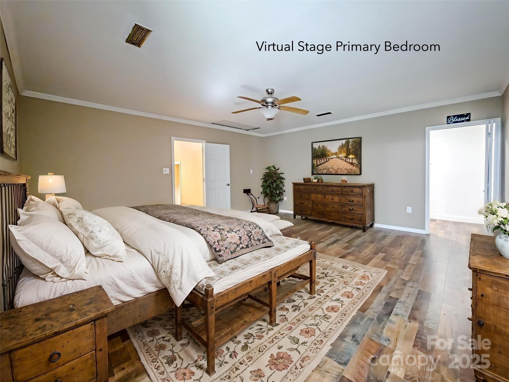 883 Pinehurst Road Ellenboro, NC 28040 - Photo 12 of 47 a bedroom with a bed and wooden floor