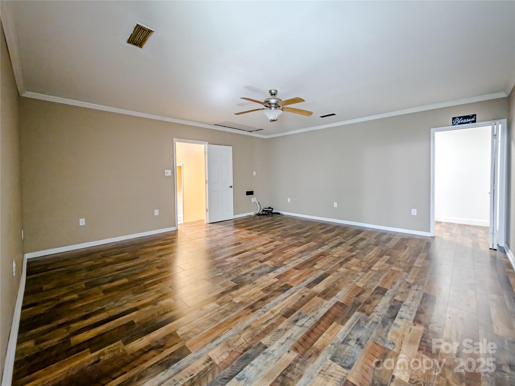 883 Pinehurst Road Ellenboro, NC 28040 - Photo 13 of 47 a view of empty room with wooden floor and fan