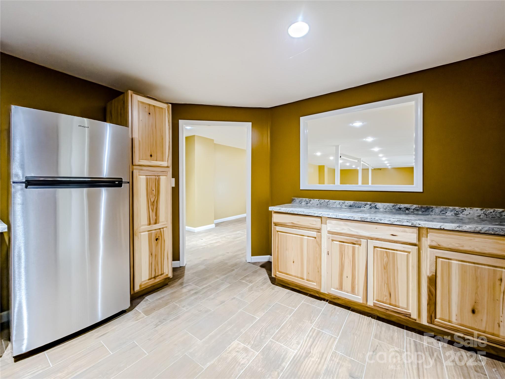 883 Pinehurst Road Ellenboro, NC 28040 - Photo 34 of 47 a kitchen with stainless steel appliances granite countertop a refrigerator a stove and a sink with granite countertops