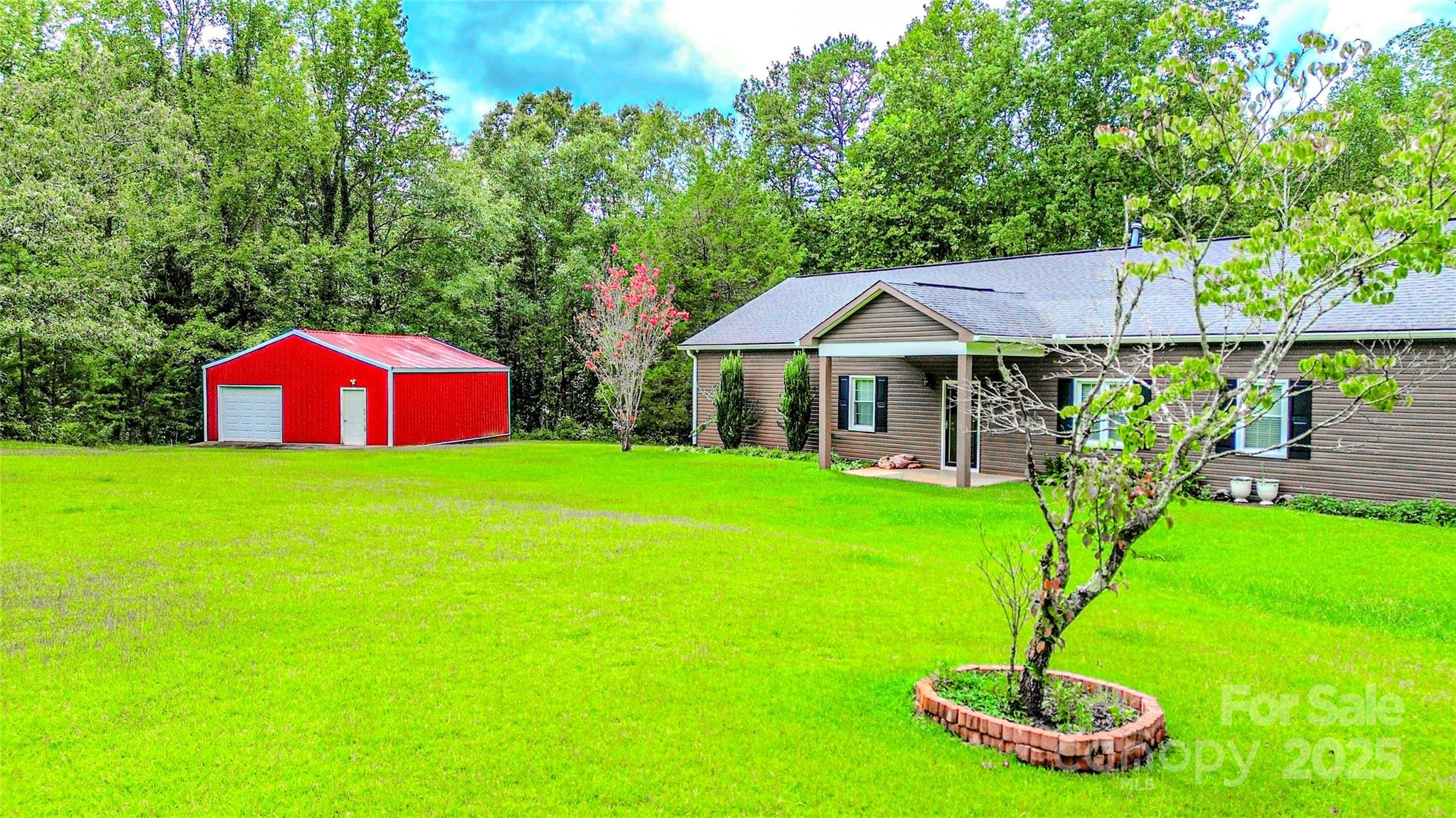 883 Pinehurst Road Ellenboro, NC 28040 - Photo 37 of 47 a front view of a house with garden