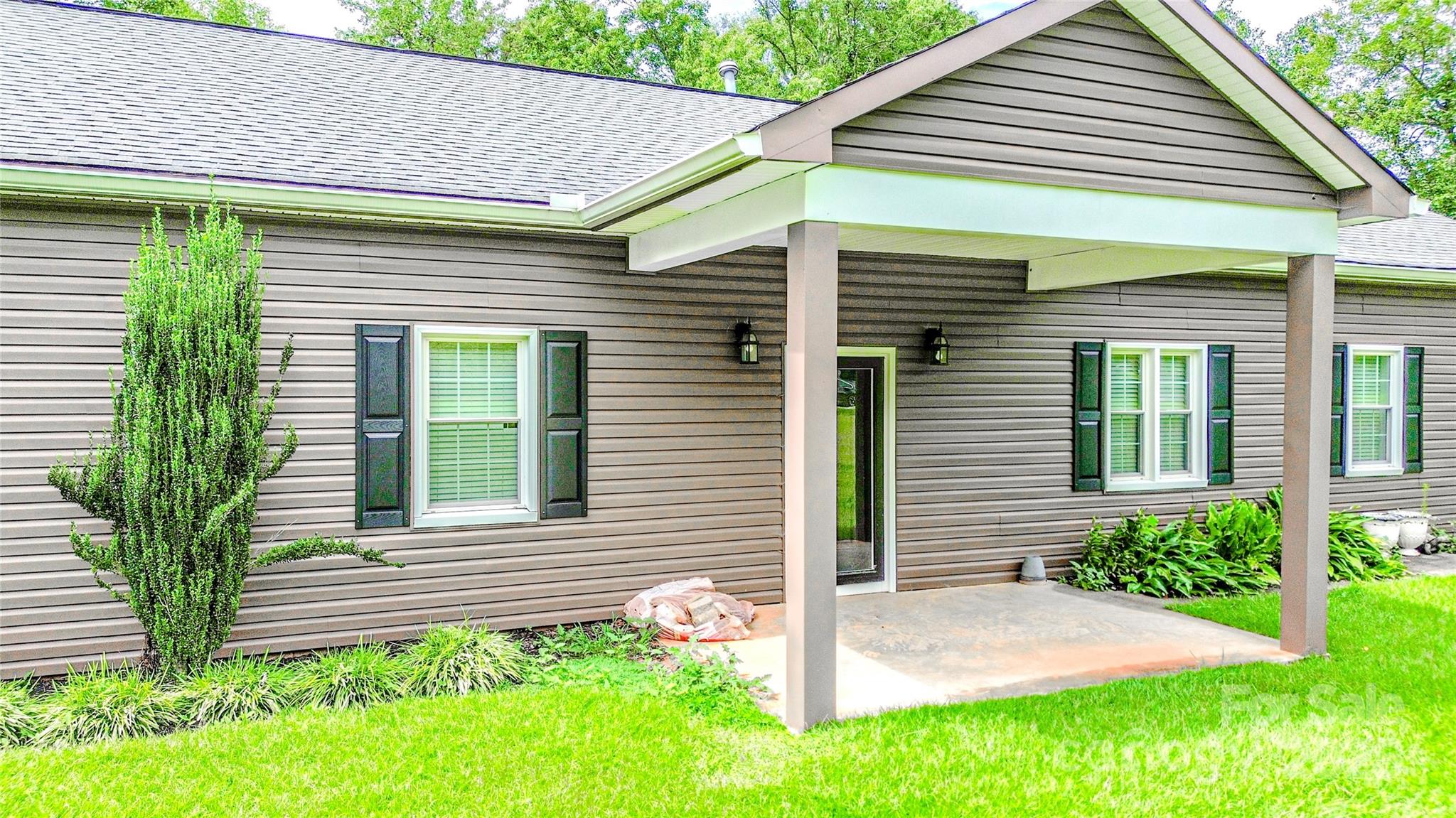 883 Pinehurst Road Ellenboro, NC 28040 - Photo 47 of 47 a front view of a house with garden