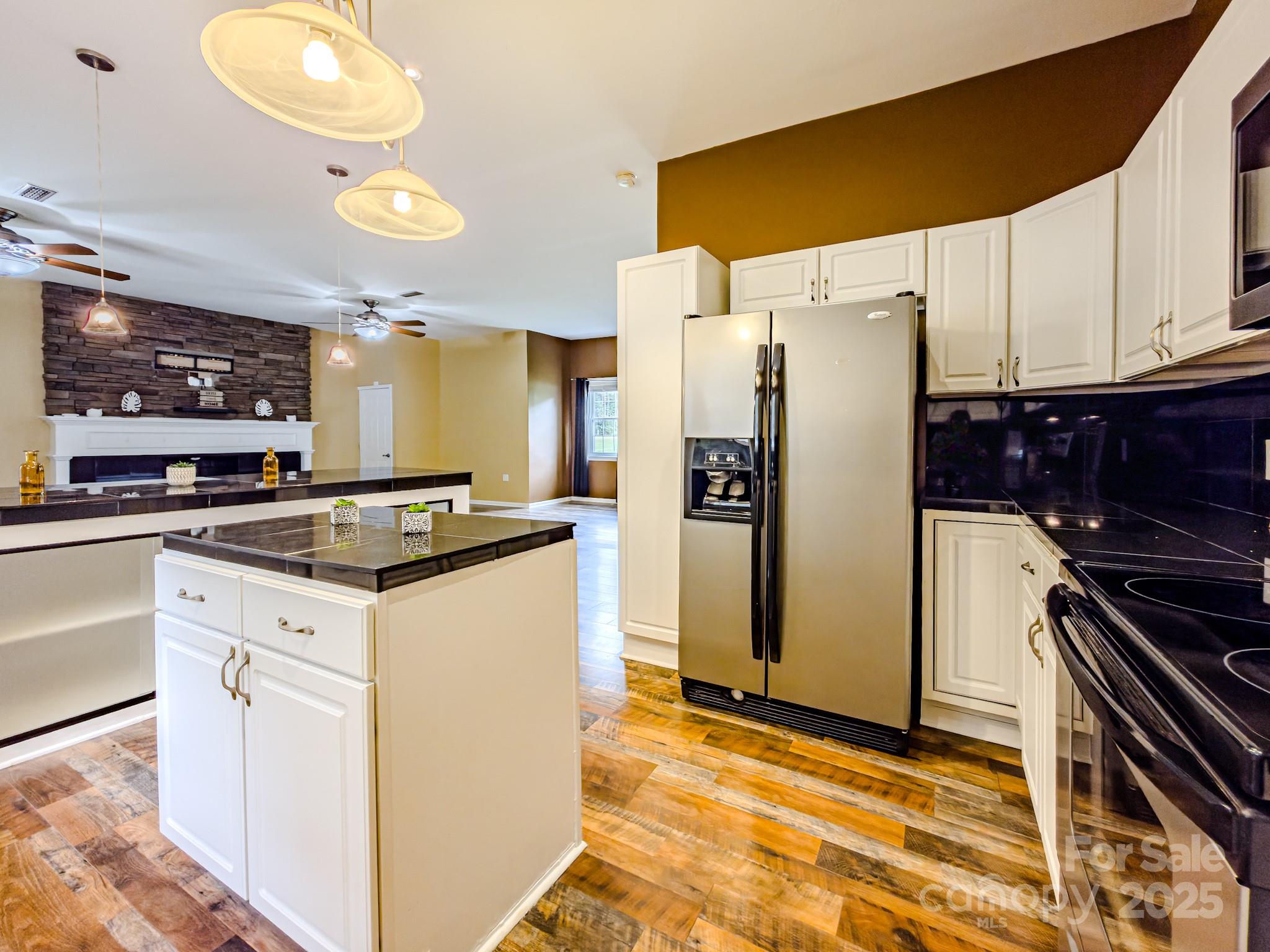 883 Pinehurst Road Ellenboro, NC 28040 - Photo 5 of 47 a kitchen with a refrigerator and a stove top oven