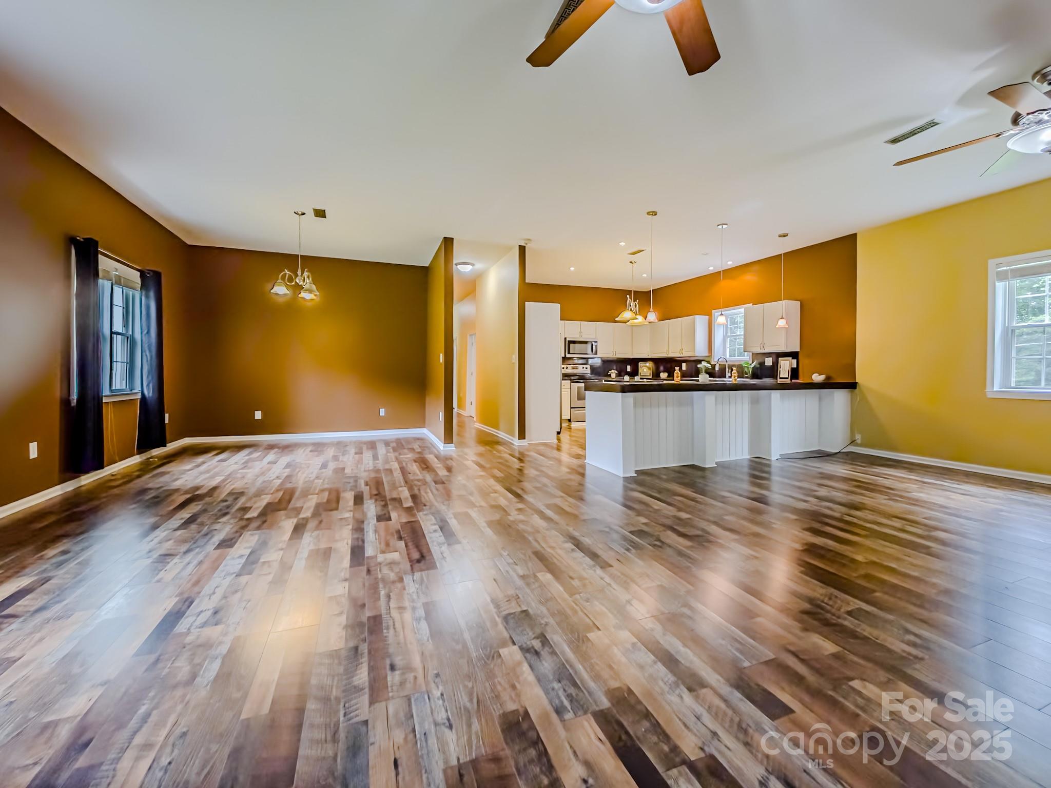 883 Pinehurst Road Ellenboro, NC 28040 - Photo 9 of 47 a view of a room with wooden floor