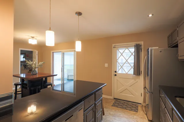 a kitchen with a table and chairs in it