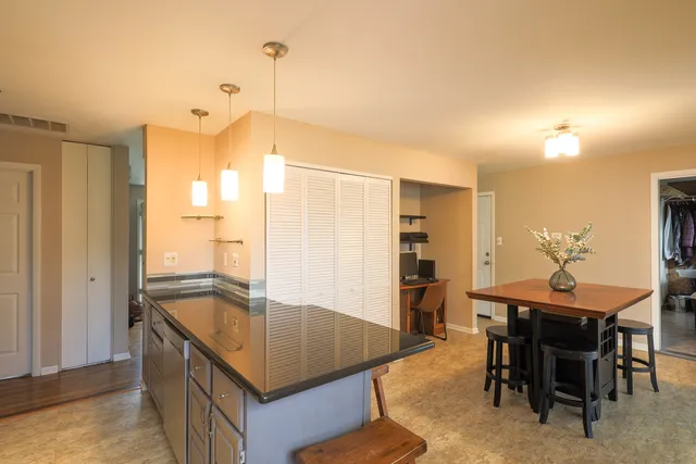 a bedroom with furniture and a large window