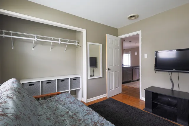 a bedroom with a bed and window