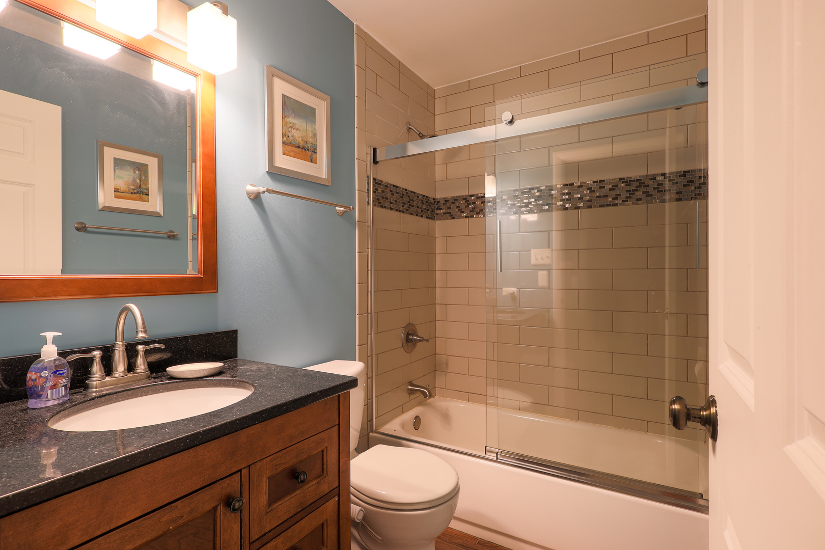 9425 Pine Street Mokena, IL 60448 - Photo 23 of 28 a bathroom with a granite countertop sink toilet and shower