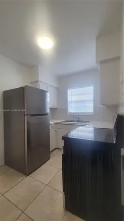 a view of an empty room with windows
