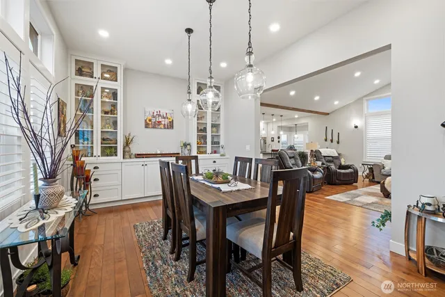 a large kitchen with a table and chairs