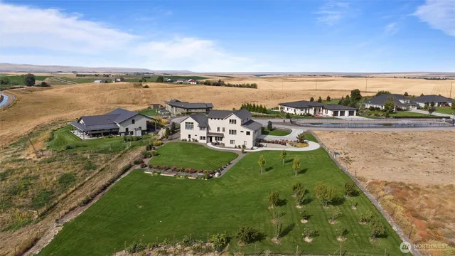 a view of a lake with houses in the back