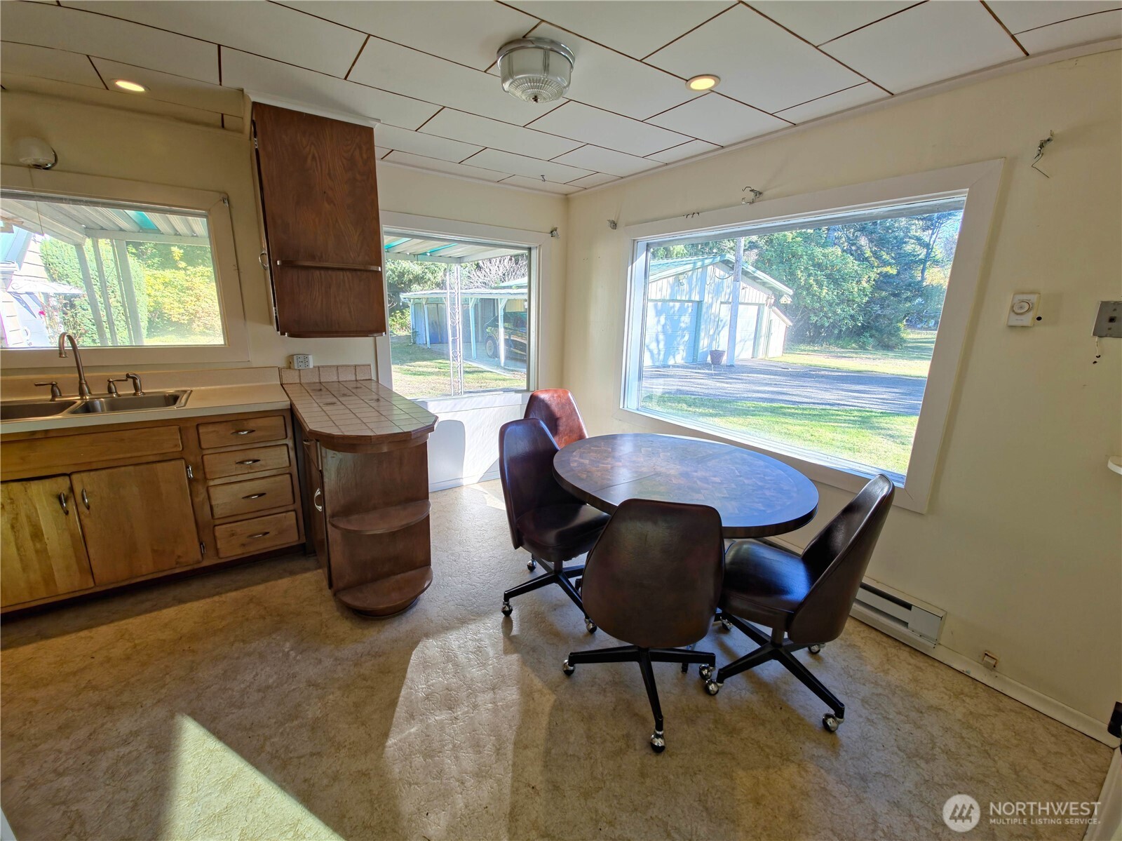 2030 Ocean Beach Road Copalis Crossing, WA 98536 - Photo 24 of 38 a dining room with furniture and window