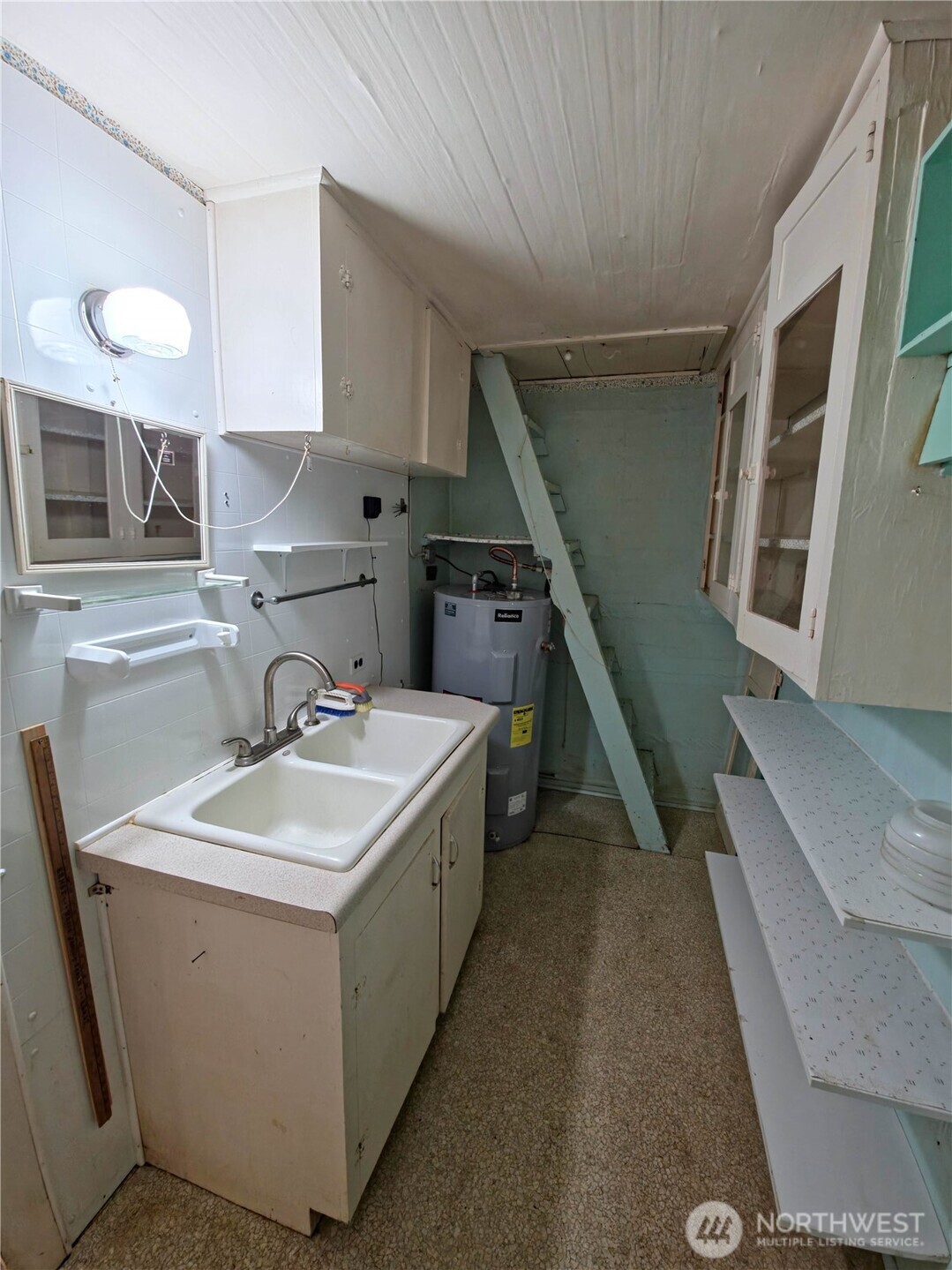 2030 Ocean Beach Road Copalis Crossing, WA 98536 - Photo 25 of 38 a kitchen with a sink a stove and chairs