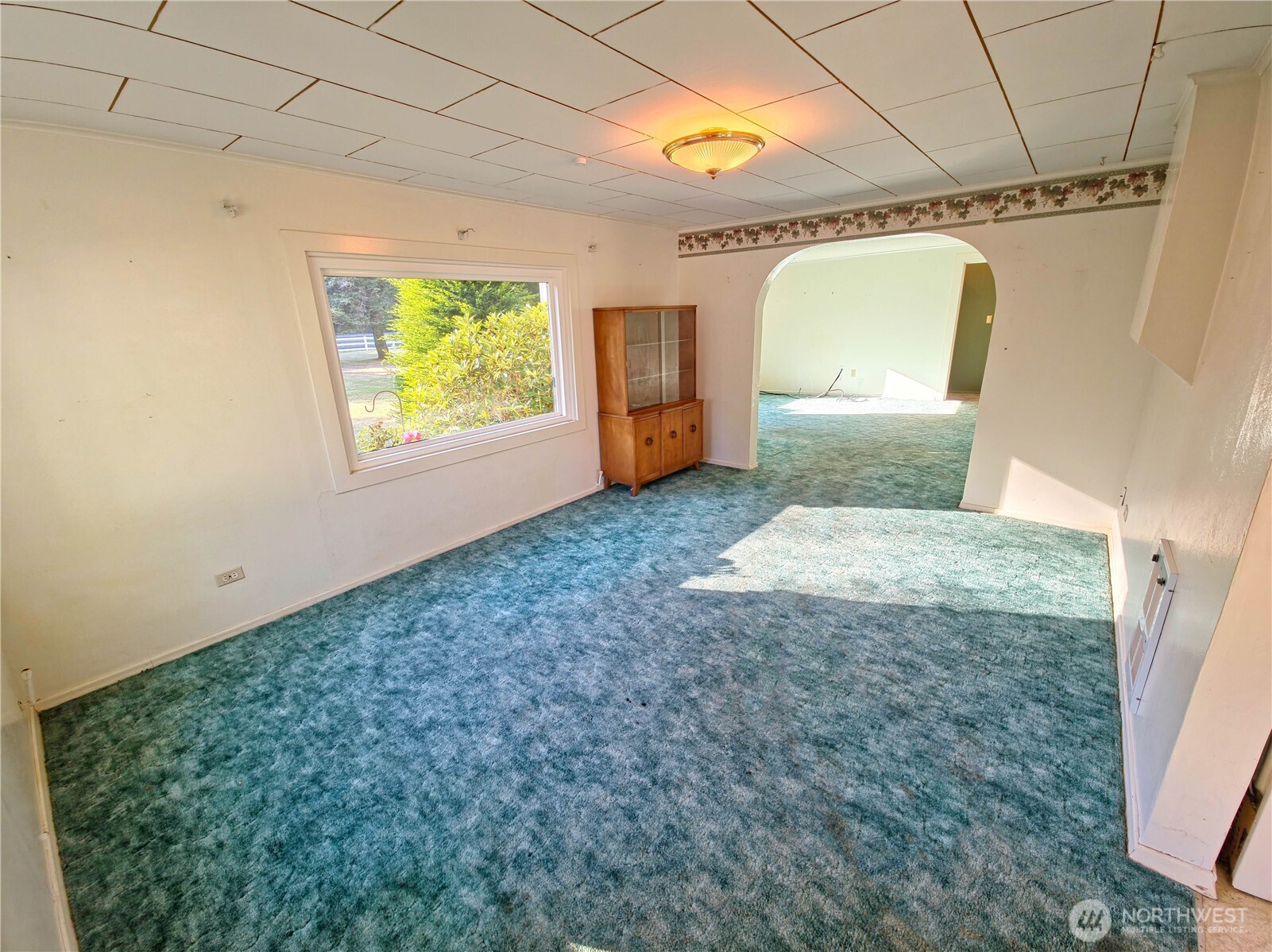 2030 Ocean Beach Road Copalis Crossing, WA 98536 - Photo 7 of 38 a view of a big room with windows and cabinet
