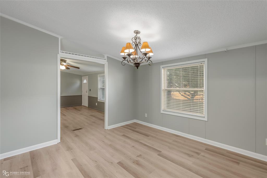 121 Kim Circle Stonewall, LA 71078 - Photo 20 of 33 wooden floor in an empty room with a window