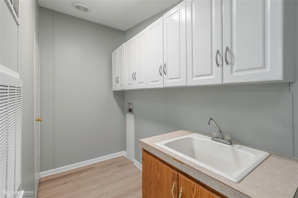 121 Kim Circle Stonewall, LA 71078 - Photo 22 of 33 a bathroom with a sink and cabinets
