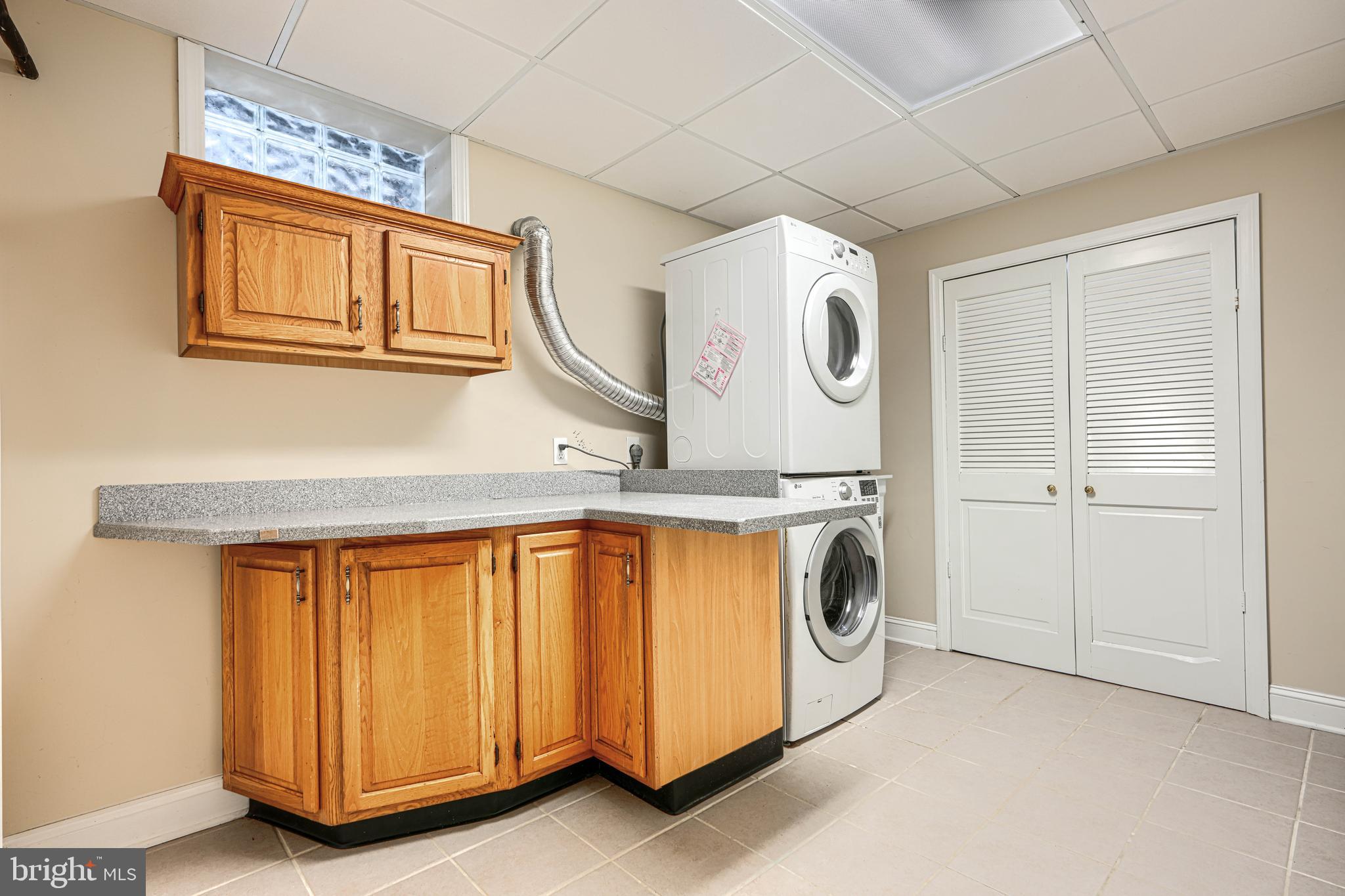 16104 Carroll Road Monkton, MD 21111 - Photo 39 of 95 laundry with shelving and counter